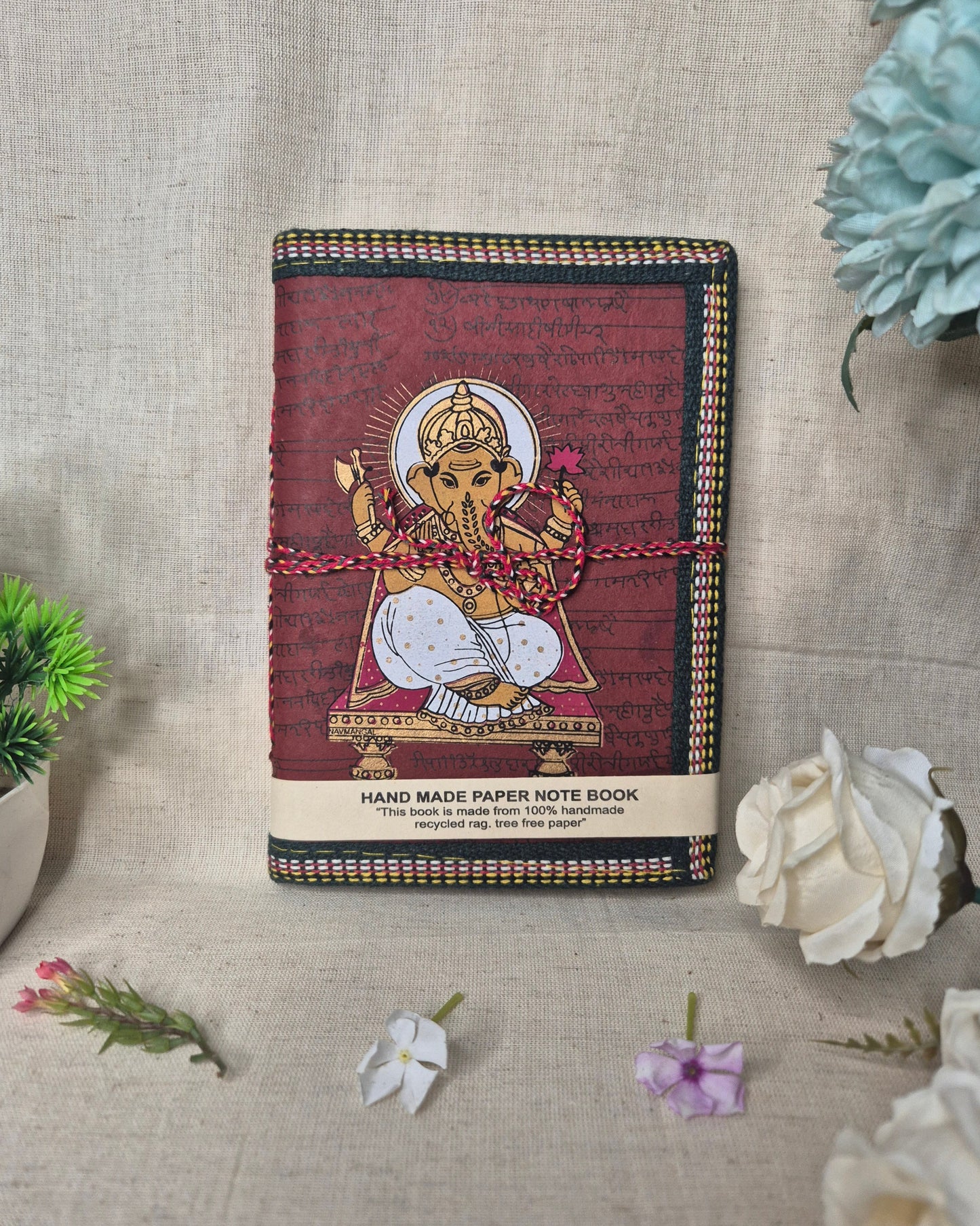 Decorative notebook with a cover design on a textured surface .