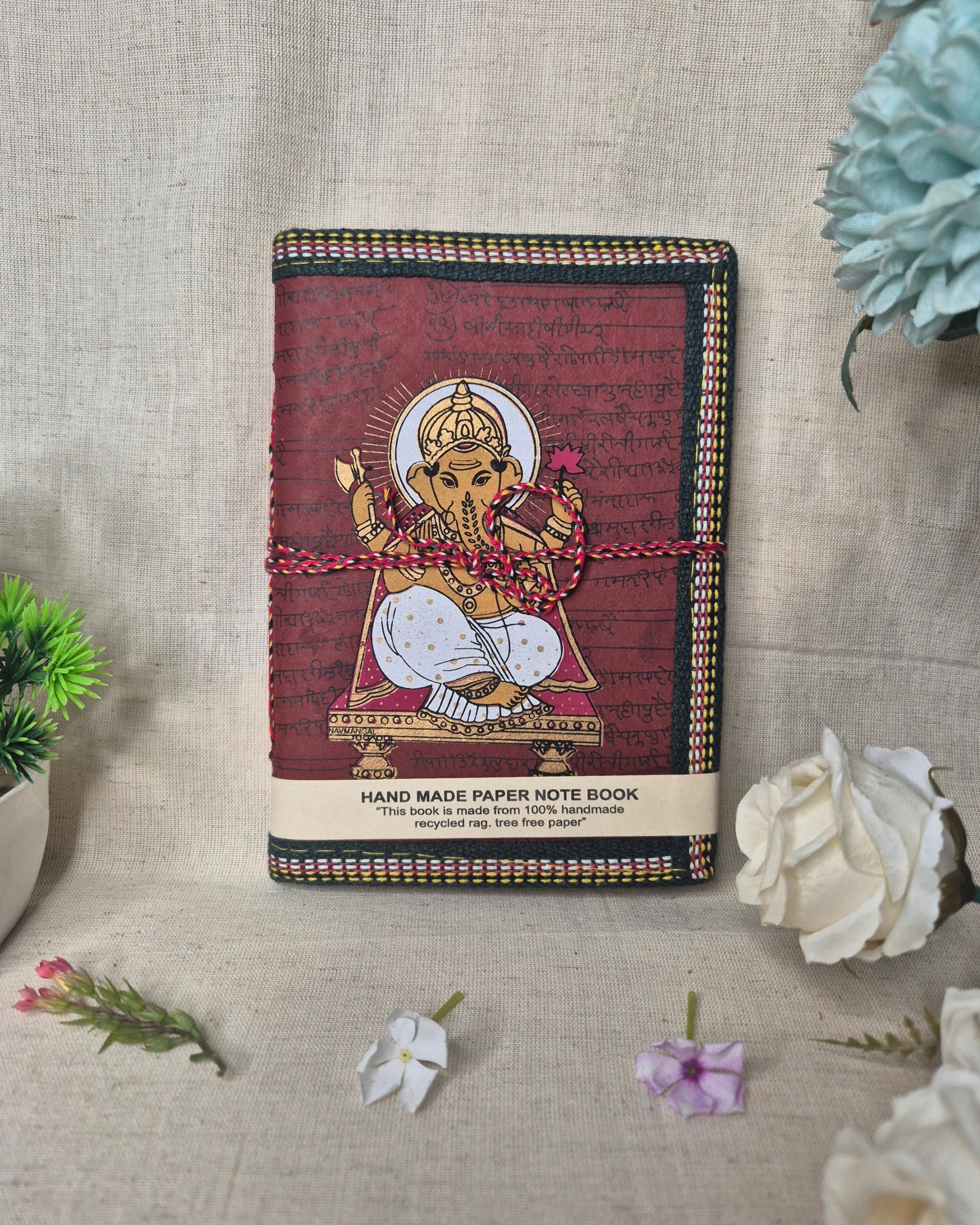 Decorative notebook with a cover design on a textured surface .