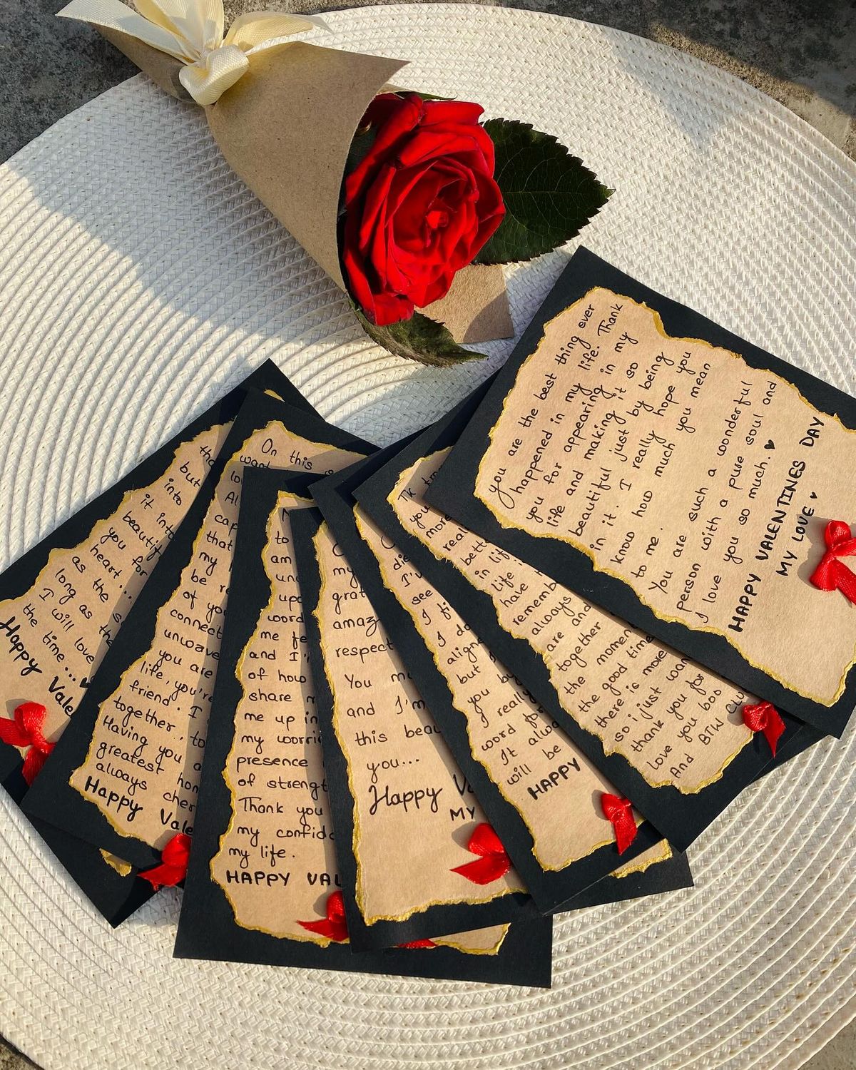 Set of Valentine's Day cards with red roses on a textured surface